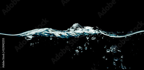 Dark water waves isolated on black background.