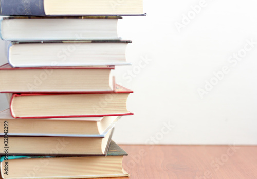 A stack of books on a table or on a shelf in a bookstore or library.Concept of education and science.