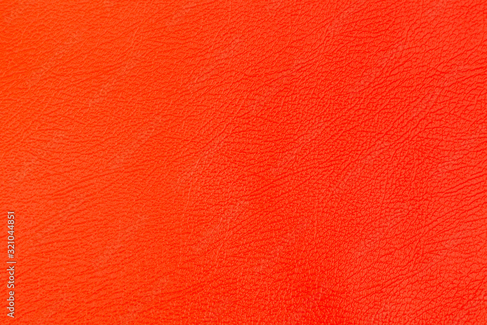 Fototapeta premium Texture of a orange leather background.