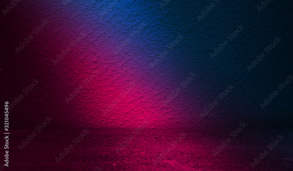 Obraz premium Dark abstract background. Background of an old concrete wall illuminated by a blue and pink neon spotlight