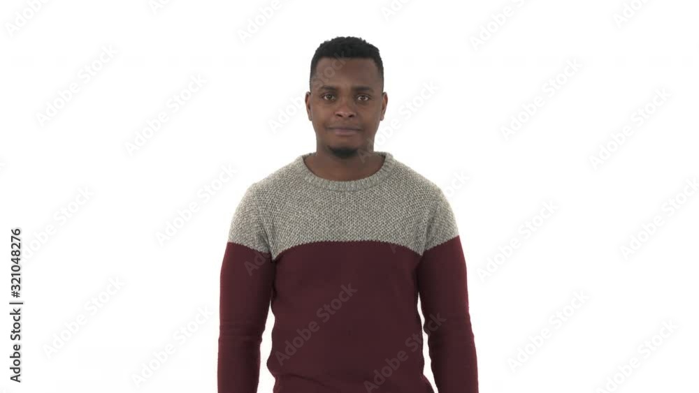 Close-up portrait of a young man pointing with index finger to the camera. Hand sign, confident gesture. Isolated, on white background Close-up portrait of a young man pointing with index finger to the camera. Hand sign, confident gesture. Isolated, on white background