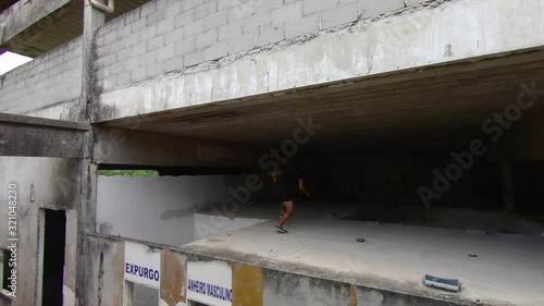 freerunner jumps to escape from a building photo