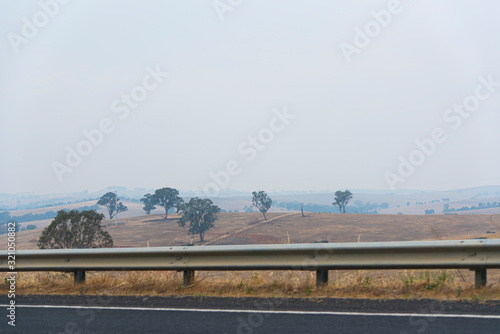 The landscape of Australia hill alongside a long road at outback of New South Wales.