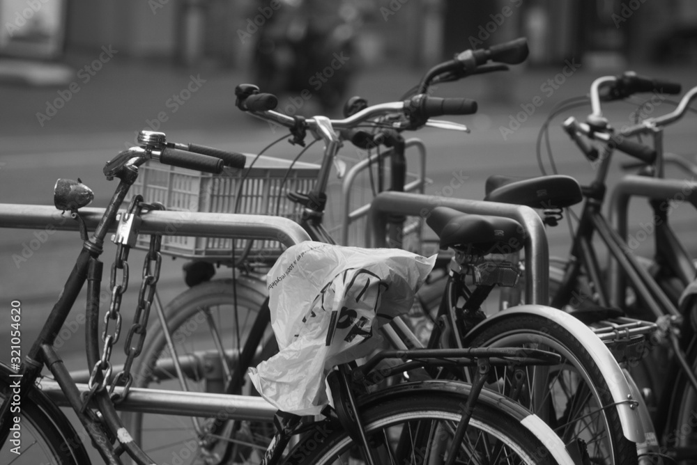 03-02-2020 amsterdam the netherlands bikes on a lock in the city of amsterdam 03-02-2020 amsterdam the netherlands bikes on a lock in the city of amsterdam