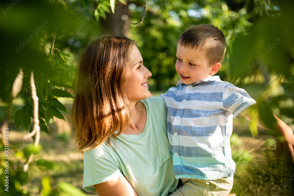 Caring mother looking at her son with love Caring mother looking at her son with love