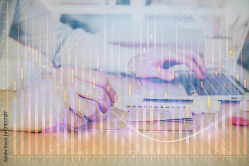 Multi exposure of financial graph with man works in office on background. Concept of analysis. © peshkova