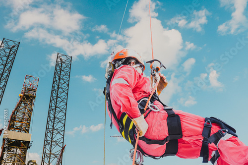 Canvas Print Rope access worker, wearing full safety body harness, face shield safety equipment protection working at height, abseiling using