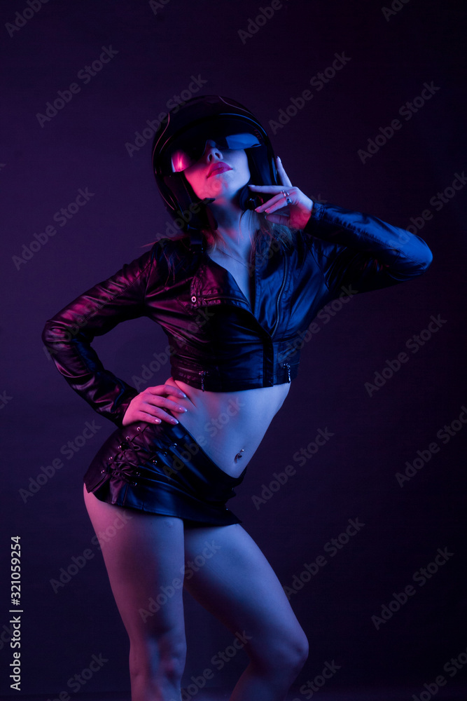 High Fashion model woman in underwear in colorful bright lights posing, portrait of a beautiful girl. Artistic colorful design. Party concept