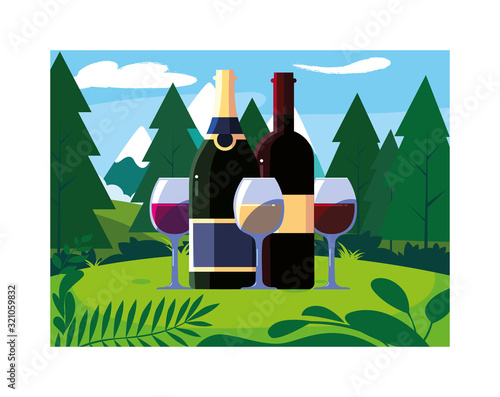 bottle and glass of wine with landscape background and nature