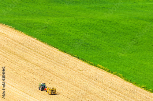 Aerial view of a tractor on a cultivated field, Sweden.