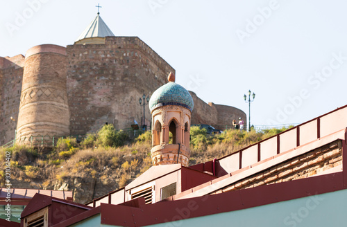 The upper part of the Tbilisi Central Mosque near the walls of the Narikhala fortress in Tbilisi city in Georgia photo