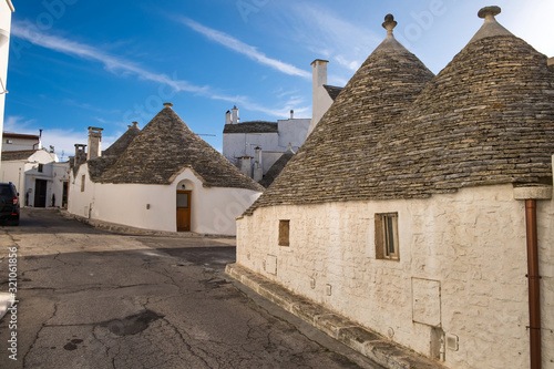 Beautiful view on the street of Trulli houses with stone roof in Alberobello  Italy