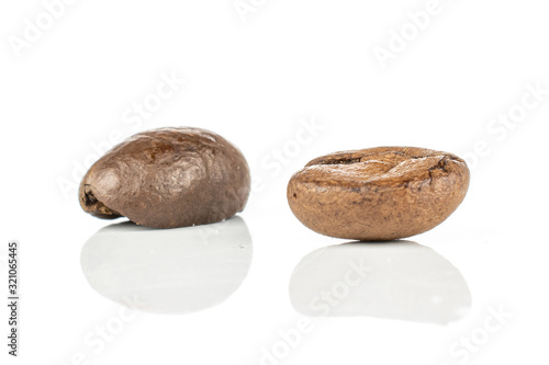 Group of two whole fresh coffee bean isolated on white background