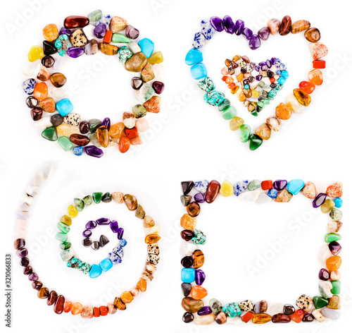 Collection of colorful semiprecious gemstones isolated on a white background.