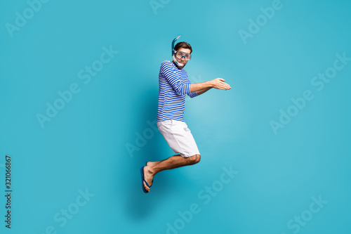 Obraz na plátně Full length profile photo of funky crazy guy tourist jump high swimming water ma