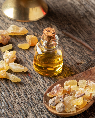 A bottle of frankincense essential oil and resin photo