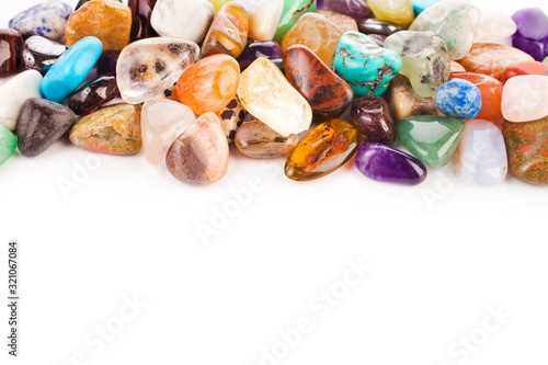 Colorful semiprecious gemstones isolated on a white background.