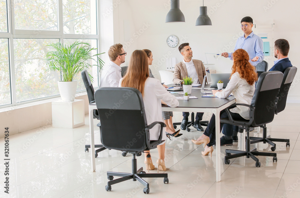 Group of business people during meeting in office Group of business people during meeting in office