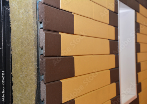 Foto House rainscreen is an exterior wall detail where the siding (wall cladding) stands off from the moisture-resistant surface of an air barrier applied to the sheeting