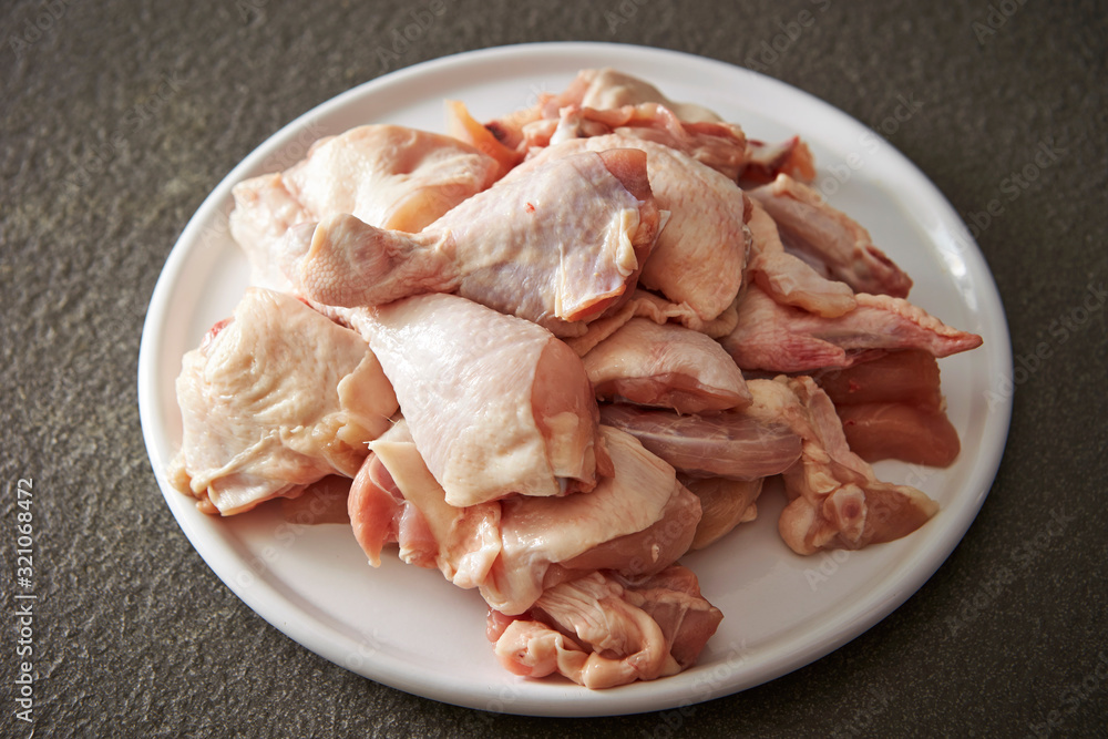 Fresh raw chicken legs on plate