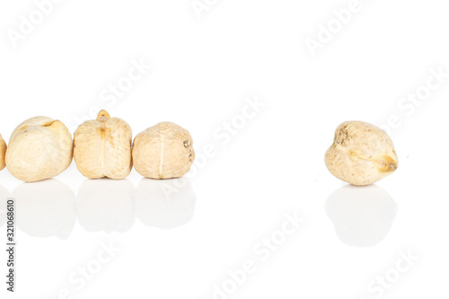 Group of four whole raw fresh tan chickpea isolated on white background