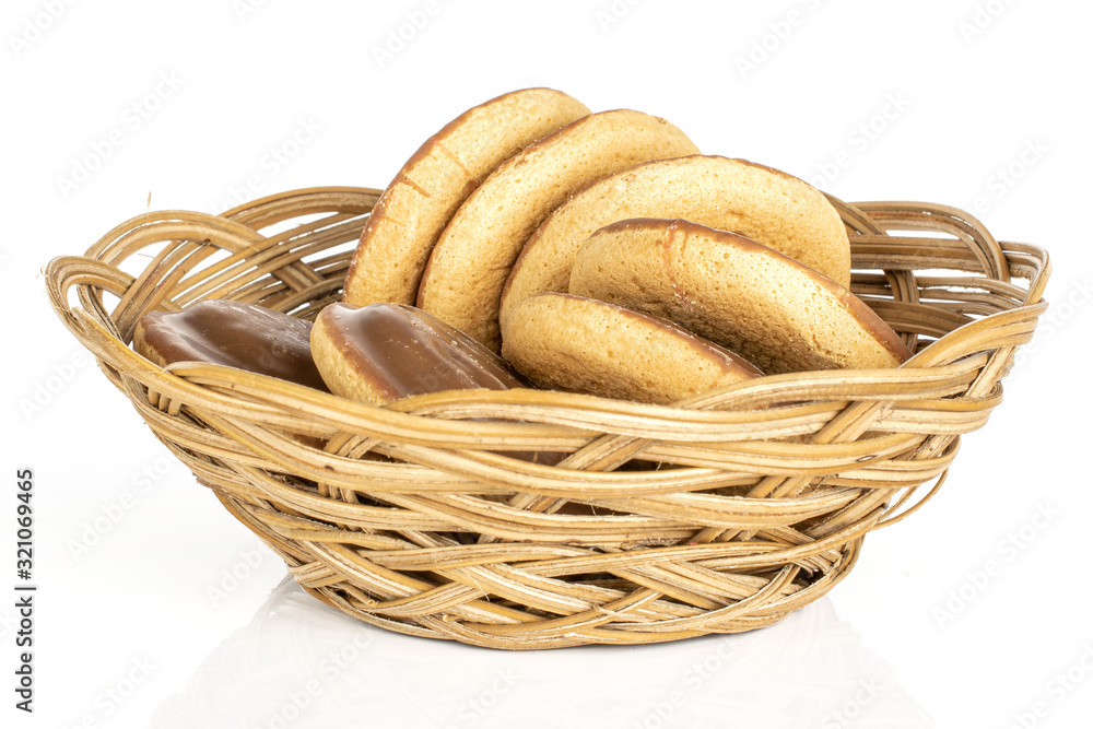 Group of seven whole chocolate biscuit in round rattan bowl isolated on white background