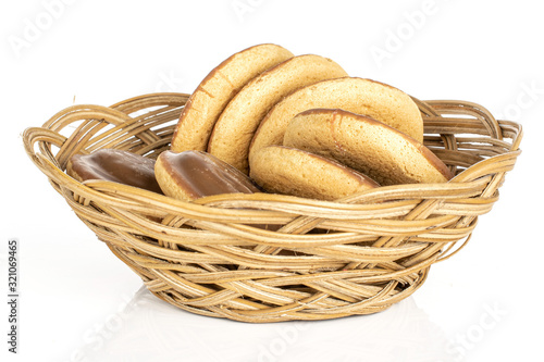 Group of seven whole chocolate biscuit in round rattan bowl isolated on white background