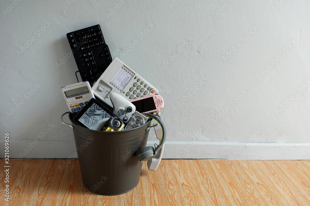Electronic Waste broken or damage In Recycle bin in the room with white