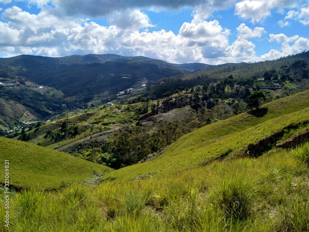Fototapeta premium Meadows and mountains under blue sky in Venezuela