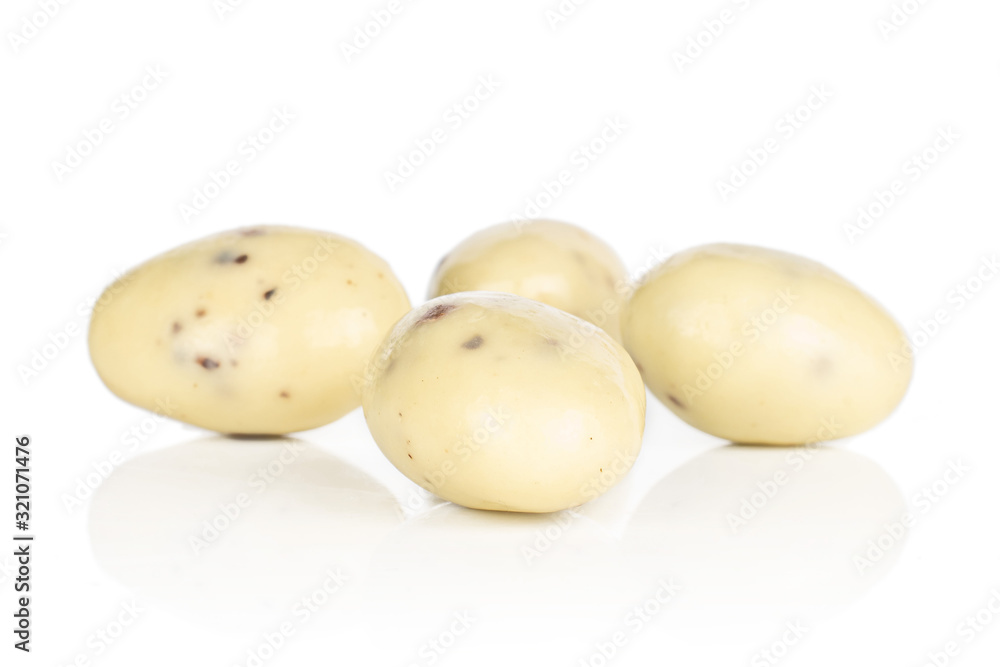 Group of four whole coated white almond nut stracciatella isolated on white background