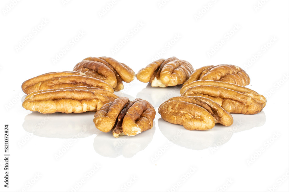 Group of eight whole tasty brown pecan half flower isolated on white background
