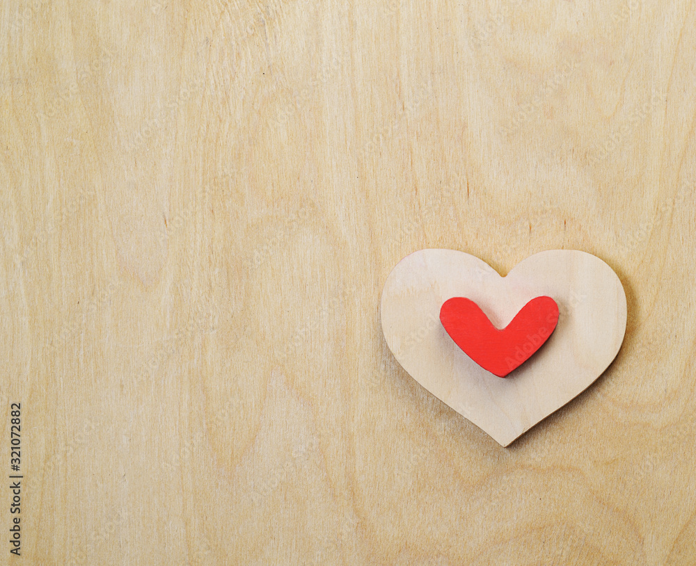 Valentine's wooden heart on a wooden background Valentine's wooden heart on a wooden background