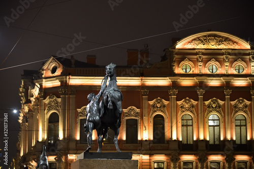 Russia, Saint Petersburg urban landscape in the night.  Horse Tamer sculpture photo