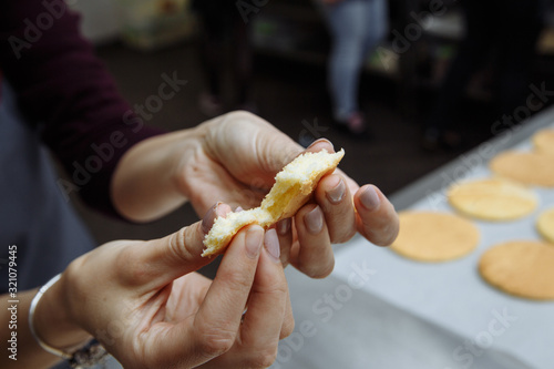 the girl checks whether the dough is prepared