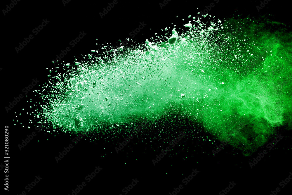 Green powder explosion on black background. Green powder explosion on black background.