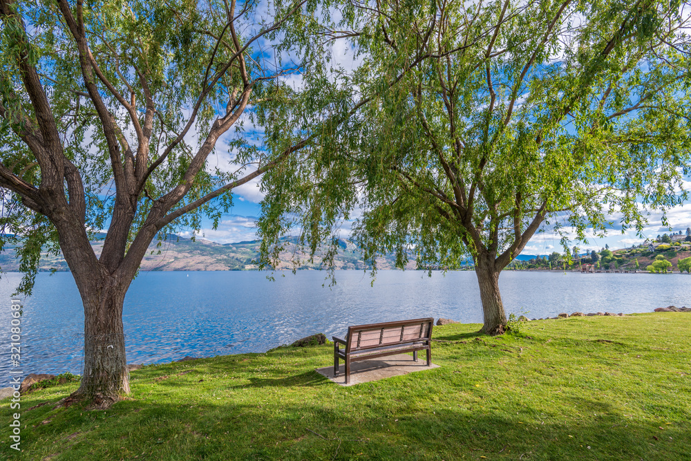 A bench with gorgeous view at mountain lake, British Columbia, Canada. A bench with gorgeous view at mountain lake, British Columbia, Canada.