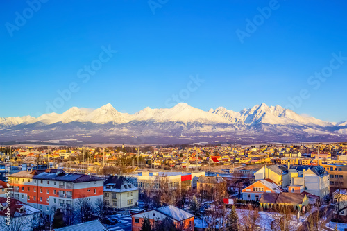 Mountains over colorful buildings and houses