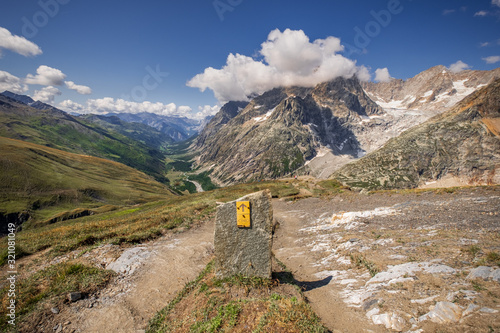 The summit of Grand Col Ferret and a view of the surrounding mountains of the European Alps