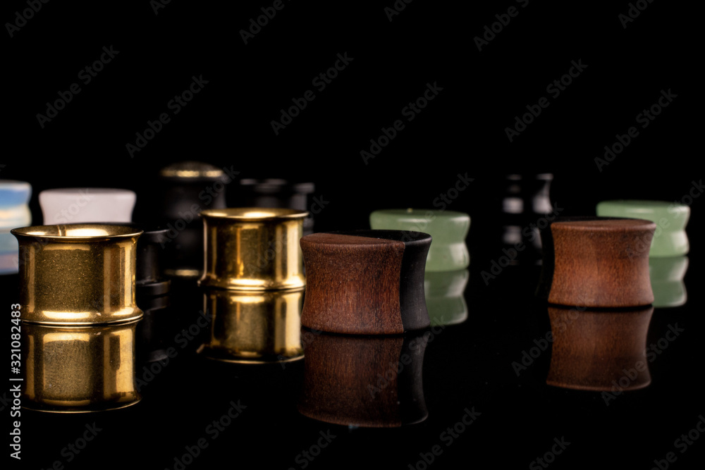 Lot of whole plug isolated on black glass Lot of whole plug isolated on black glass