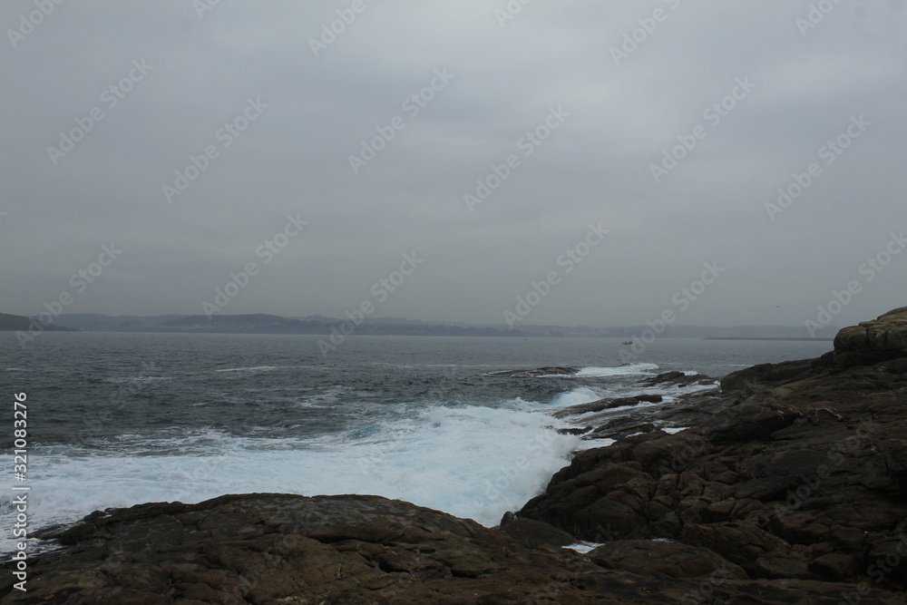 CCliffs, waves and fog in Atlantic Ocean near A coruna. CCliffs, waves and fog in Atlantic Ocean near A coruna.