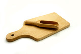 Wooden kitchen utensils on white background. Cutting board and scoop.