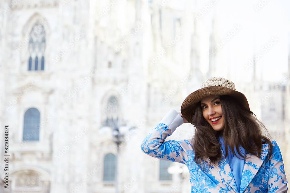 Portrait of a female model in front of the Duomo of Milan italy during the day