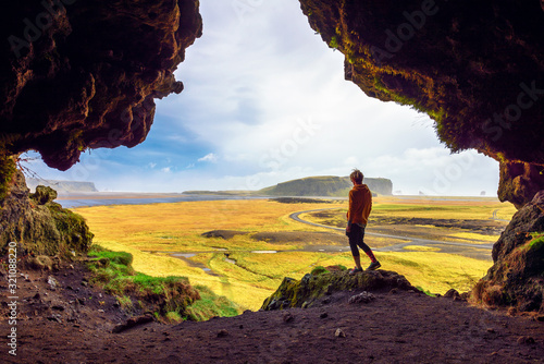 Hiker in the Loftsalahellir Cave near the village of Vik in Iceland