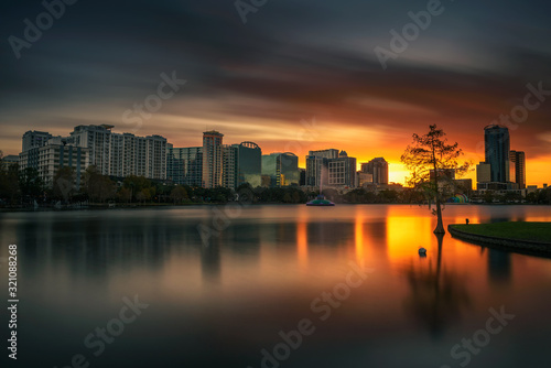Colorful sunset above Lake Eola and city skyline in Orlando, Florida