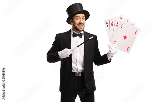 Fotografia Cheerful magician with a magic wand and 4 aces