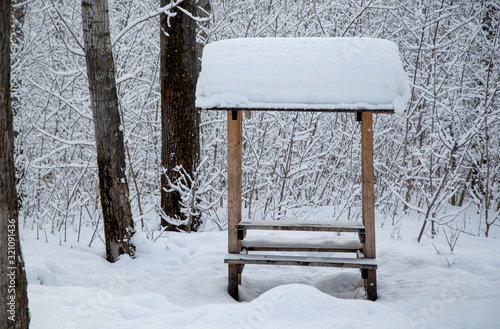 gazebo for relaxing in the winter forest