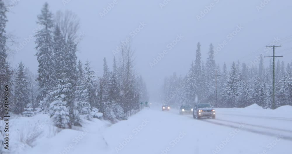 Car driving during winter snow storm in Whistler, BC, Canada. Car driving during winter snow storm in Whistler, BC, Canada.