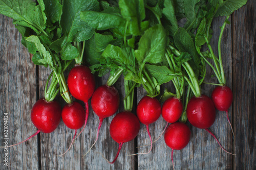 close up of fresh garden radish on wooden background 