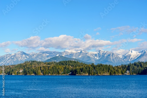 Fantastic view over ocean, snow mountain and rocks at Sechelt inlet in Vancouver, Canada. © karamysh