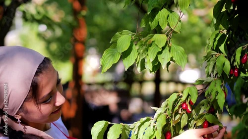 A beautiful young girl picked dogwood and smiling